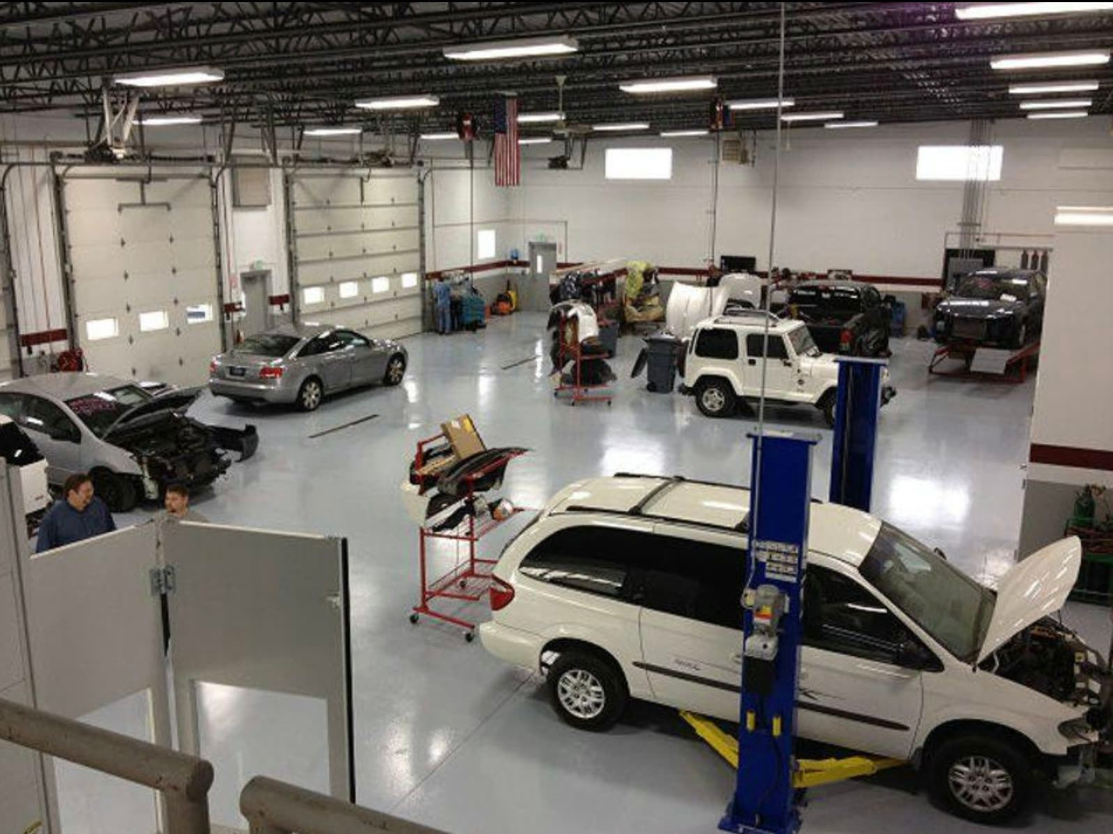 Group II shop floor — multiple vehicles in repair across the bays