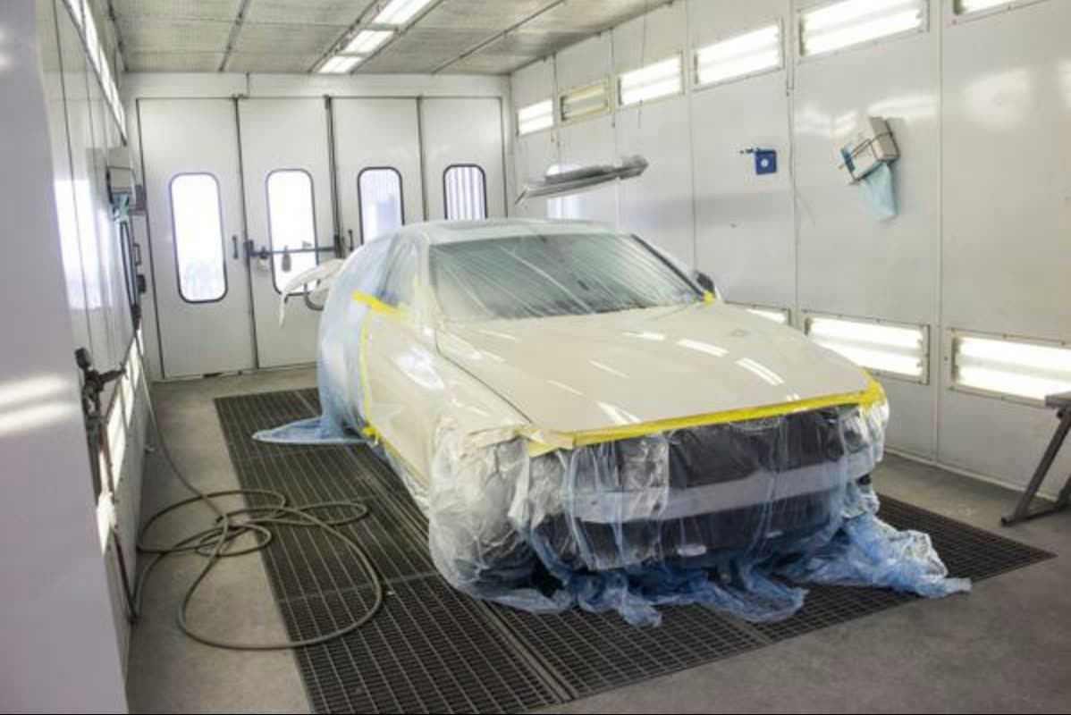 Mustang masked off in the spray booth ready for finish coat
